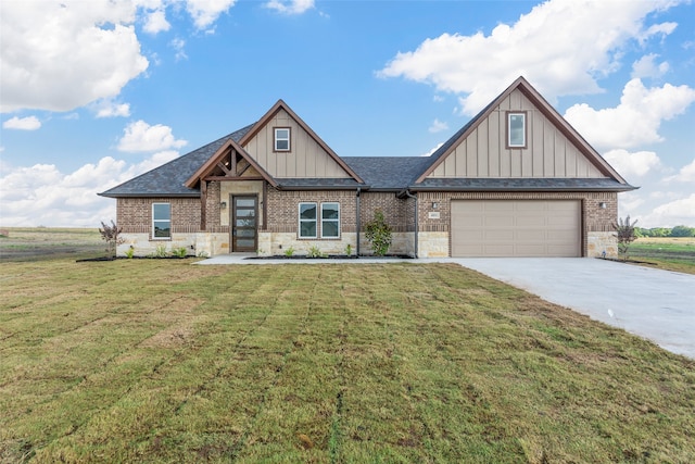 craftsman inspired home featuring a front yard and a garage