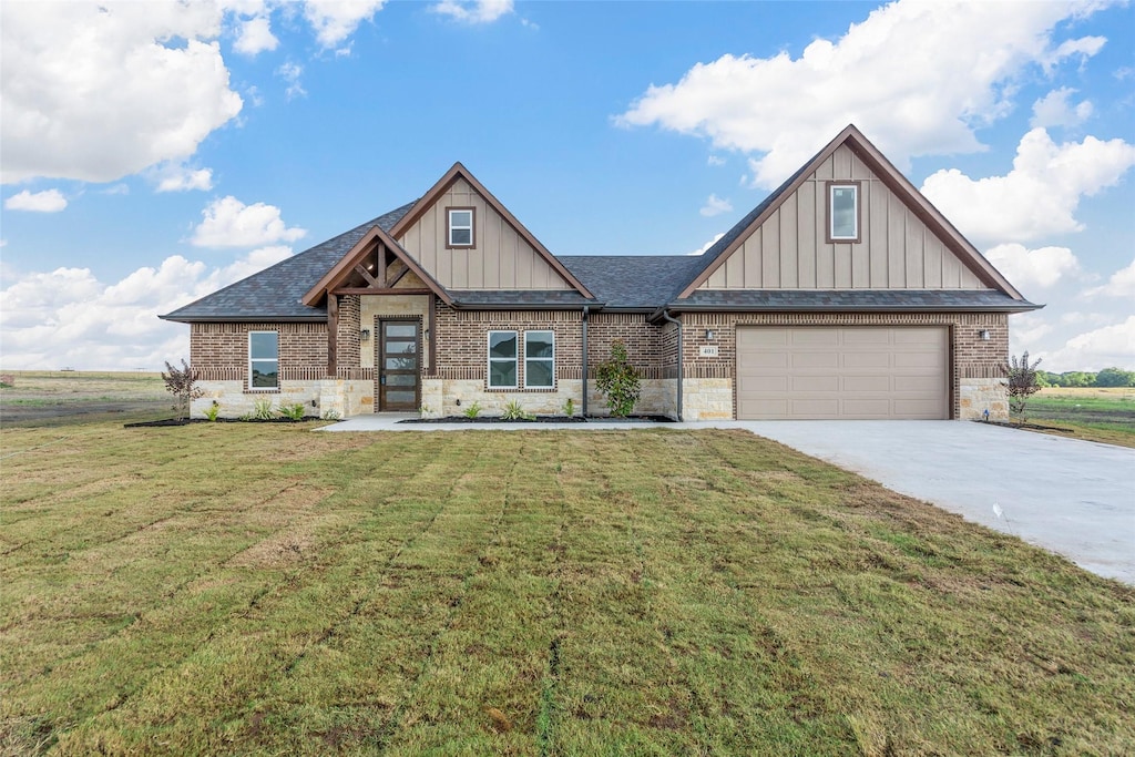 craftsman-style home with a garage and a front lawn