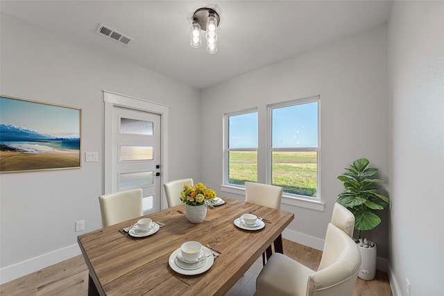 dining area with light wood-type flooring