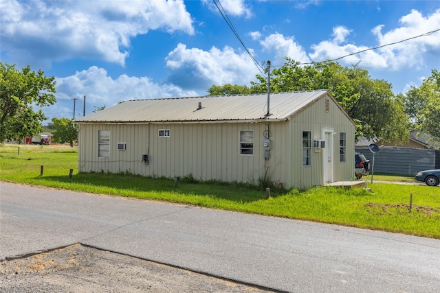 view of home's exterior with a lawn