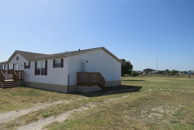 view of home's exterior featuring a yard