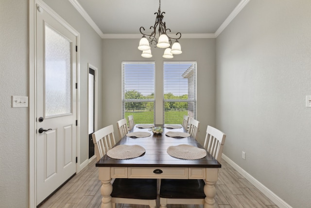 kitchen with ceiling fan, hanging light fixtures, ornamental molding, sink, and a stone fireplace