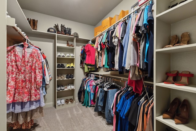 spacious closet with carpet flooring