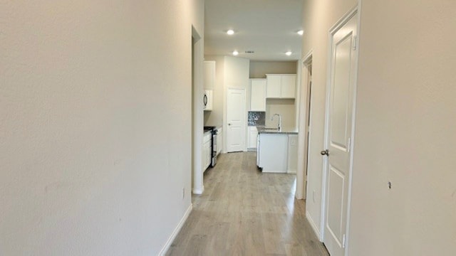 hall featuring light hardwood / wood-style floors