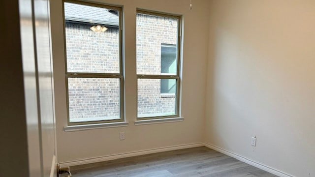 spare room with light hardwood / wood-style floors