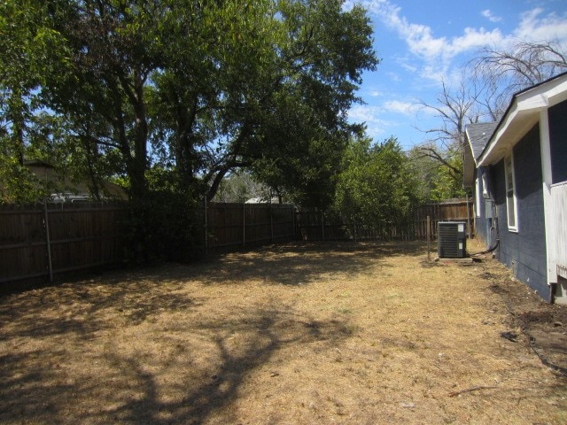 view of yard with central AC unit