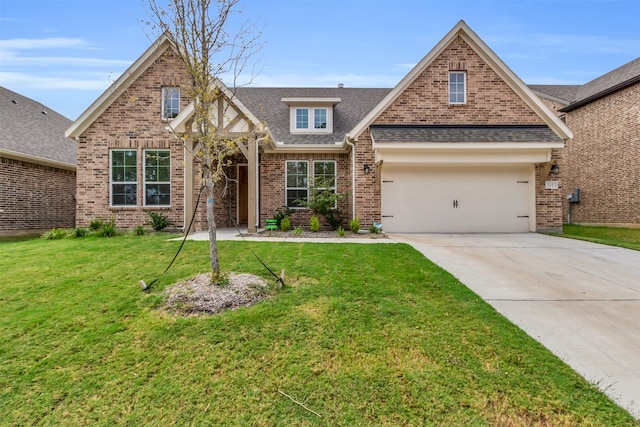 view of front of home featuring a garage and a front lawn