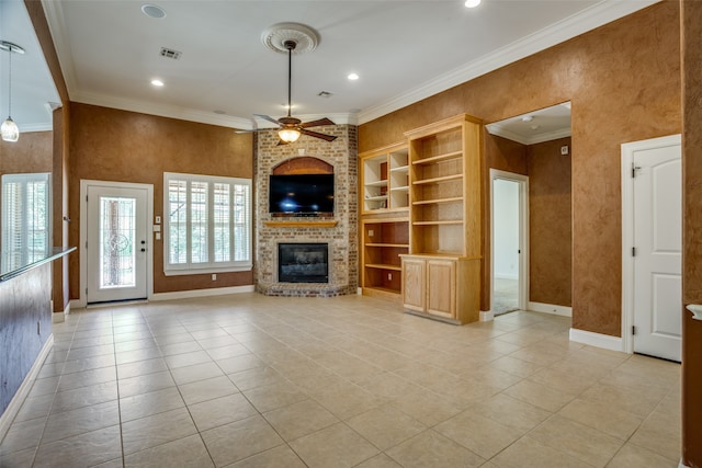 unfurnished living room featuring light tile patterned floors, built in features, ceiling fan, brick wall, and a fireplace