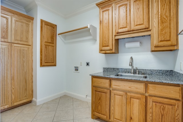 kitchen with light tile patterned floors, dark stone countertops, crown molding, and sink