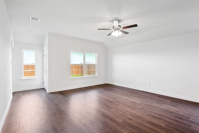 unfurnished room with dark hardwood / wood-style floors, vaulted ceiling, and ceiling fan