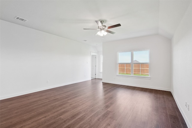 unfurnished room featuring dark wood-type flooring, vaulted ceiling, and ceiling fan