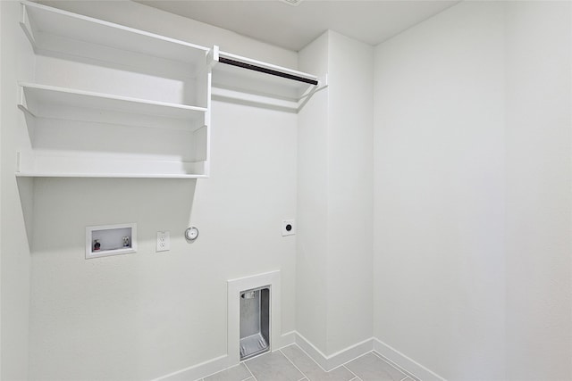 laundry room with gas dryer hookup, light tile patterned floors, washer hookup, and electric dryer hookup