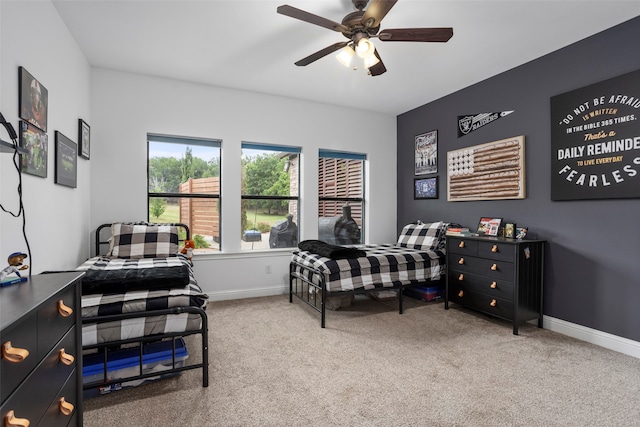 carpeted bedroom with ceiling fan