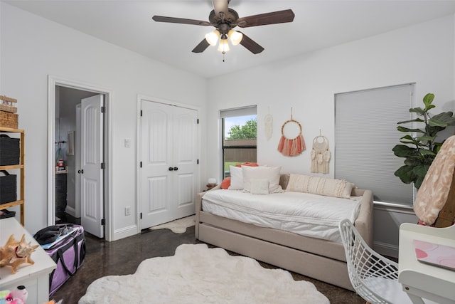 bedroom featuring ceiling fan and a closet