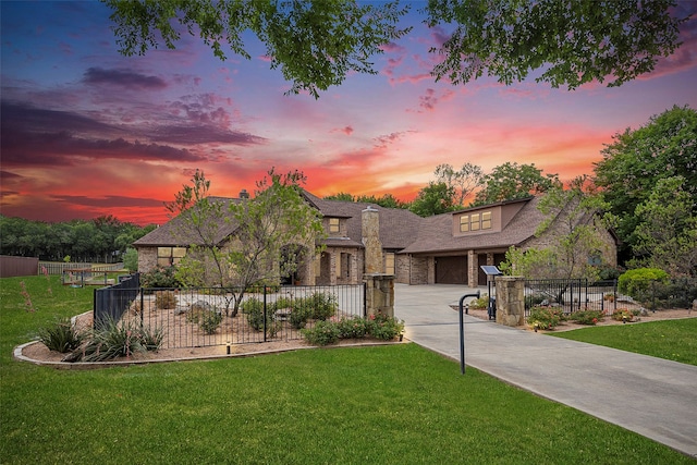 view of front of house with a lawn and a garage