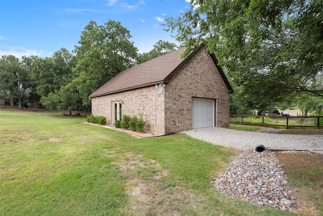 garage with a lawn