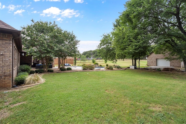 view of yard with a garage