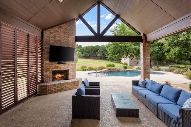 view of patio with an outdoor living space with a fireplace