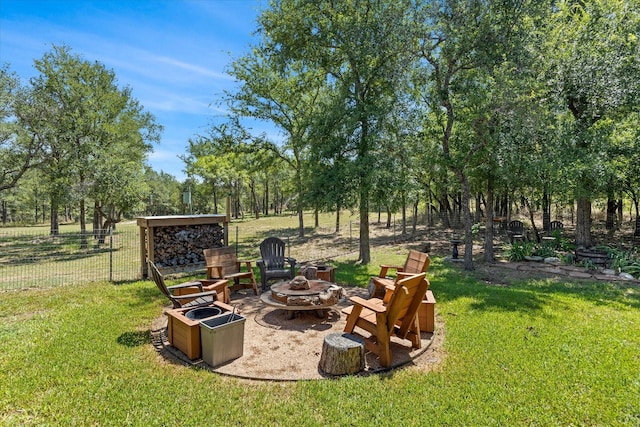 view of yard featuring an outdoor fire pit