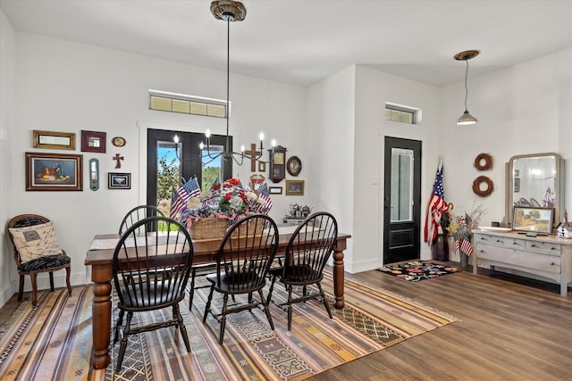 dining space featuring a chandelier and hardwood / wood-style floors