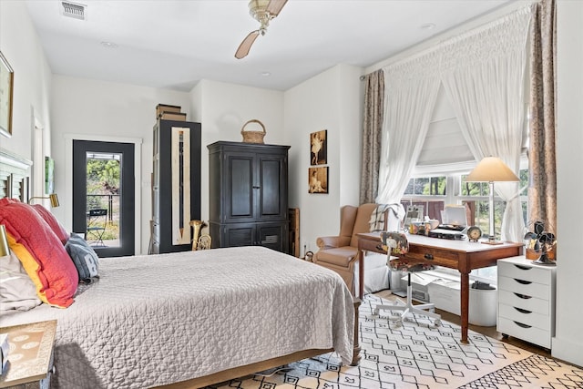 bedroom featuring ceiling fan and multiple windows