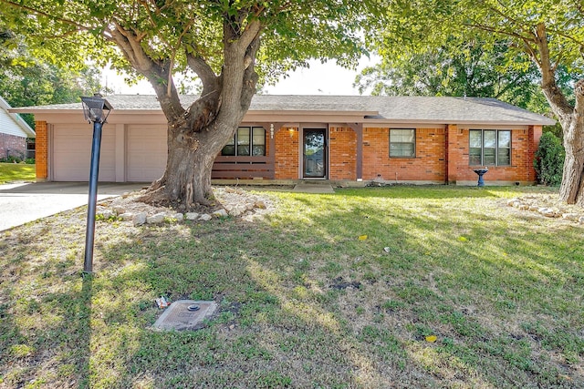 single story home featuring a garage and a front lawn