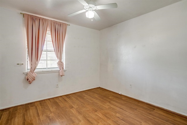 empty room featuring ceiling fan and light hardwood / wood-style flooring