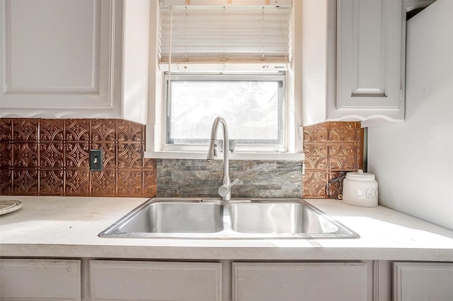 kitchen with tasteful backsplash and sink