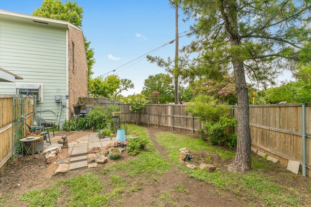 view of yard with a patio area and central air condition unit