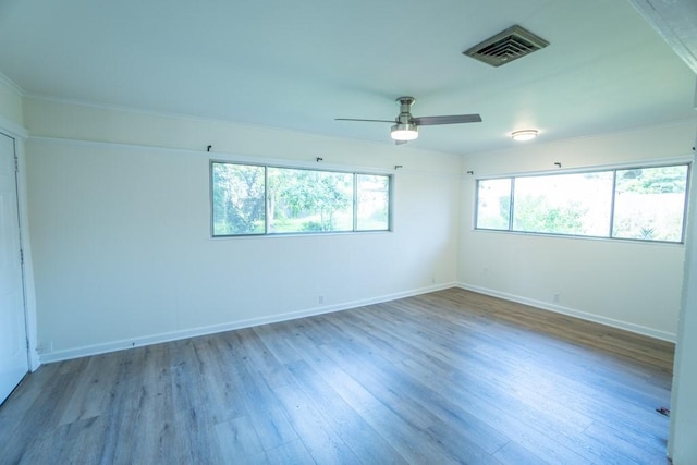 empty room featuring light wood-type flooring and ceiling fan