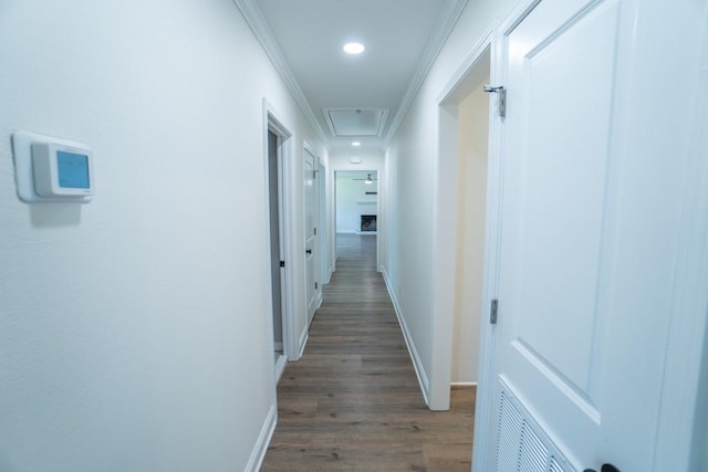 hall featuring wood-type flooring and ornamental molding