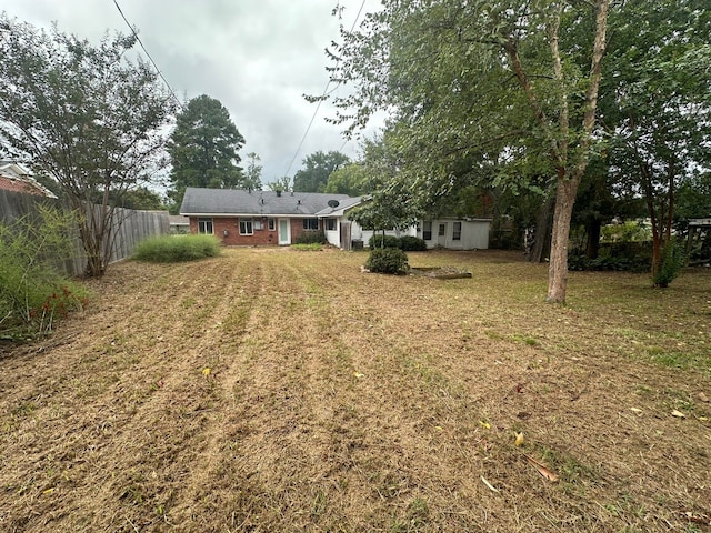 view of yard with a storage unit