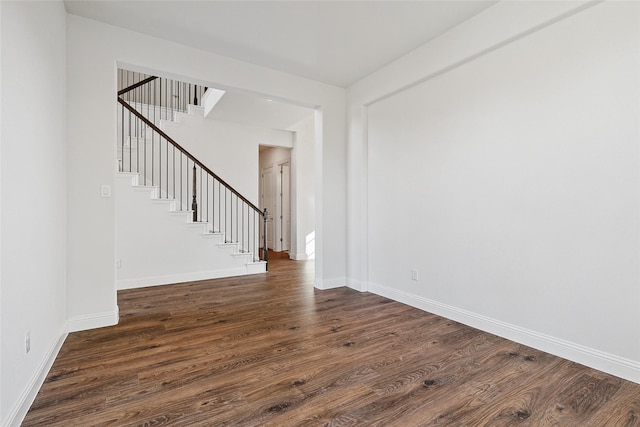 unfurnished room featuring dark hardwood / wood-style floors