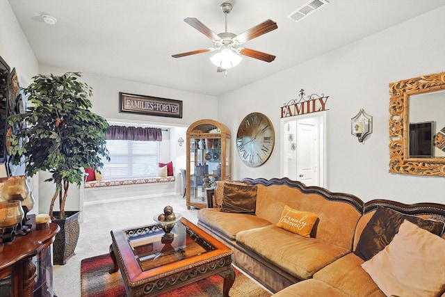 living room featuring ceiling fan and carpet flooring