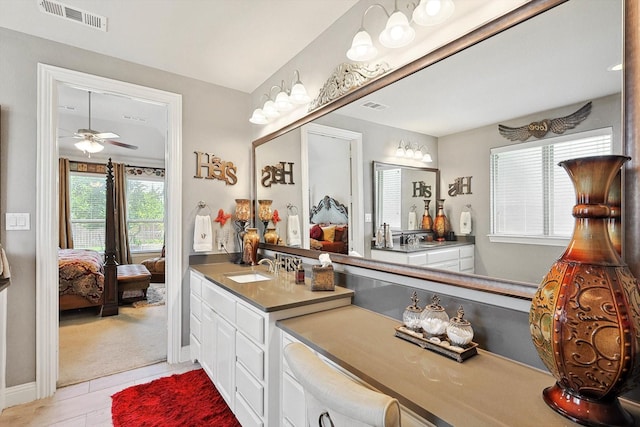 bathroom with ceiling fan, tile patterned floors, and vanity