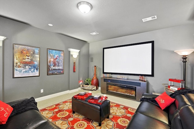 cinema room with light colored carpet