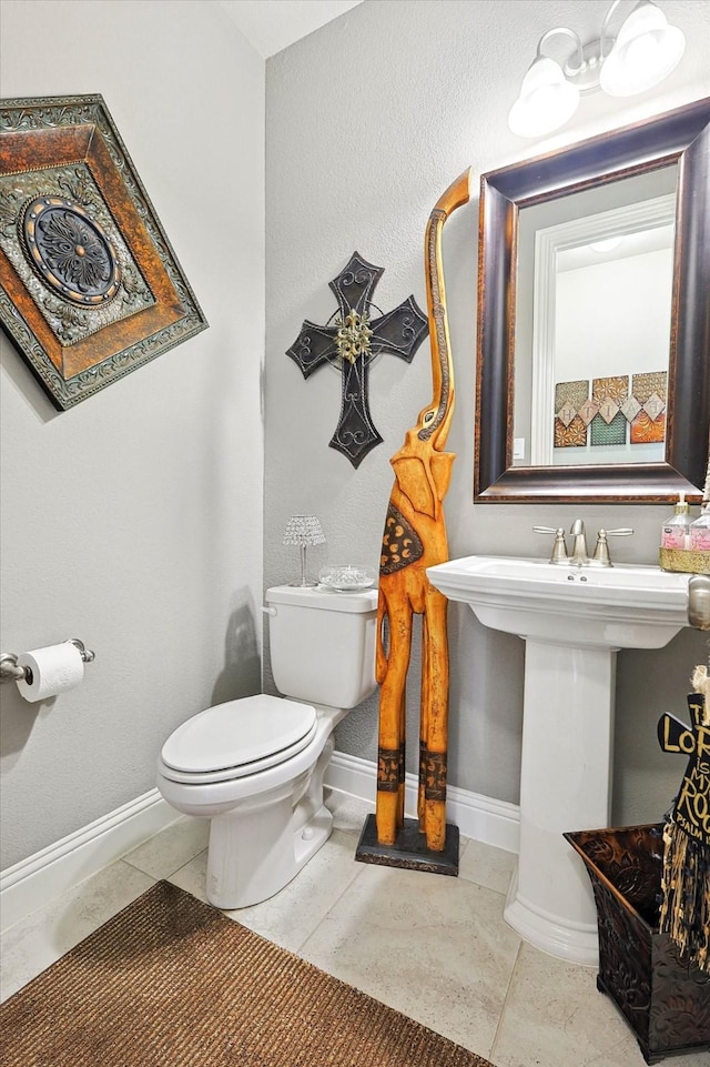 bathroom featuring tile patterned floors and toilet