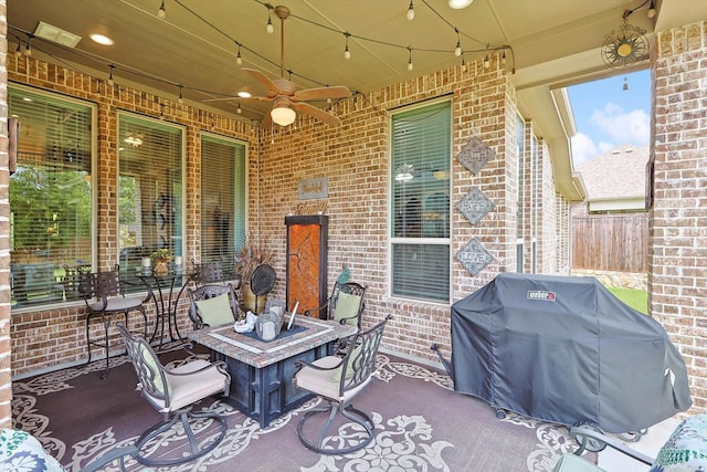 view of patio / terrace featuring ceiling fan and a grill