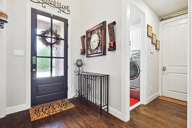 foyer entrance featuring washer / dryer, dark hardwood / wood-style floors, and plenty of natural light