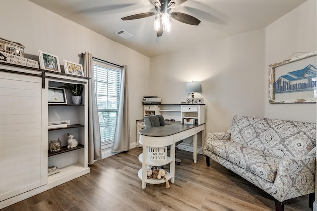 office space with ceiling fan and hardwood / wood-style floors