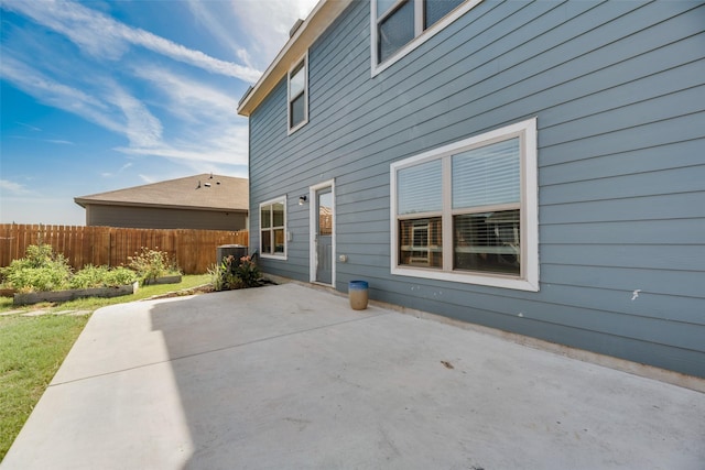 exterior space with a patio area and cooling unit