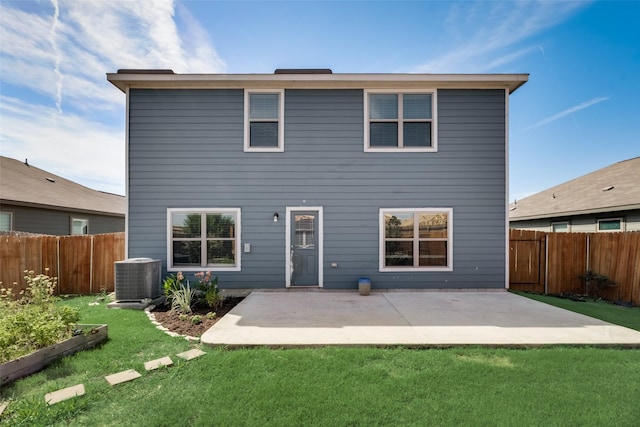 back of property with a patio area, a yard, and cooling unit