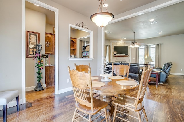 dining room featuring ceiling fan and hardwood / wood-style flooring