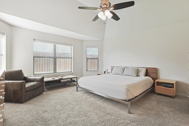 bedroom with lofted ceiling, ceiling fan, and carpet