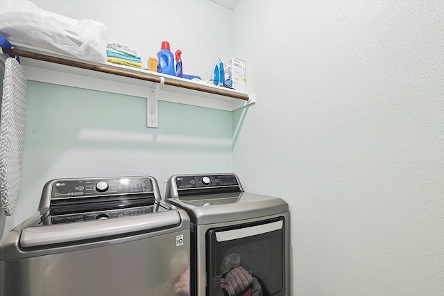 laundry room with independent washer and dryer