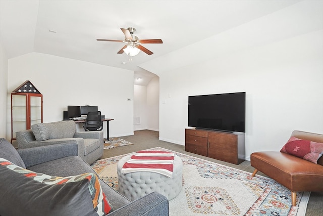 living room featuring carpet flooring, ceiling fan, and vaulted ceiling