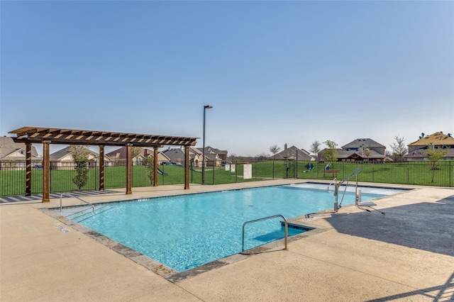 view of swimming pool with a yard, a patio, and a pergola