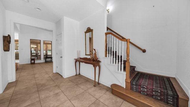 stairway featuring tile patterned floors