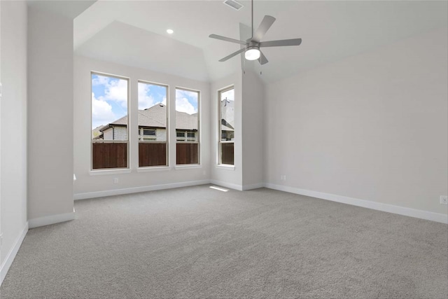 carpeted empty room with lofted ceiling and ceiling fan