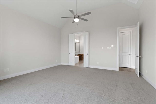 unfurnished bedroom with ceiling fan, carpet flooring, and high vaulted ceiling